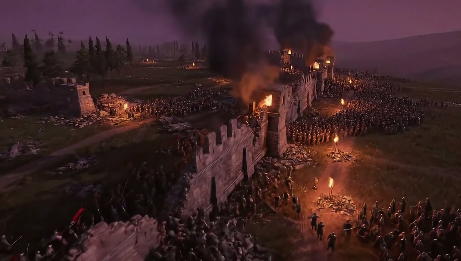 An army camps outside a burning wall at dusk