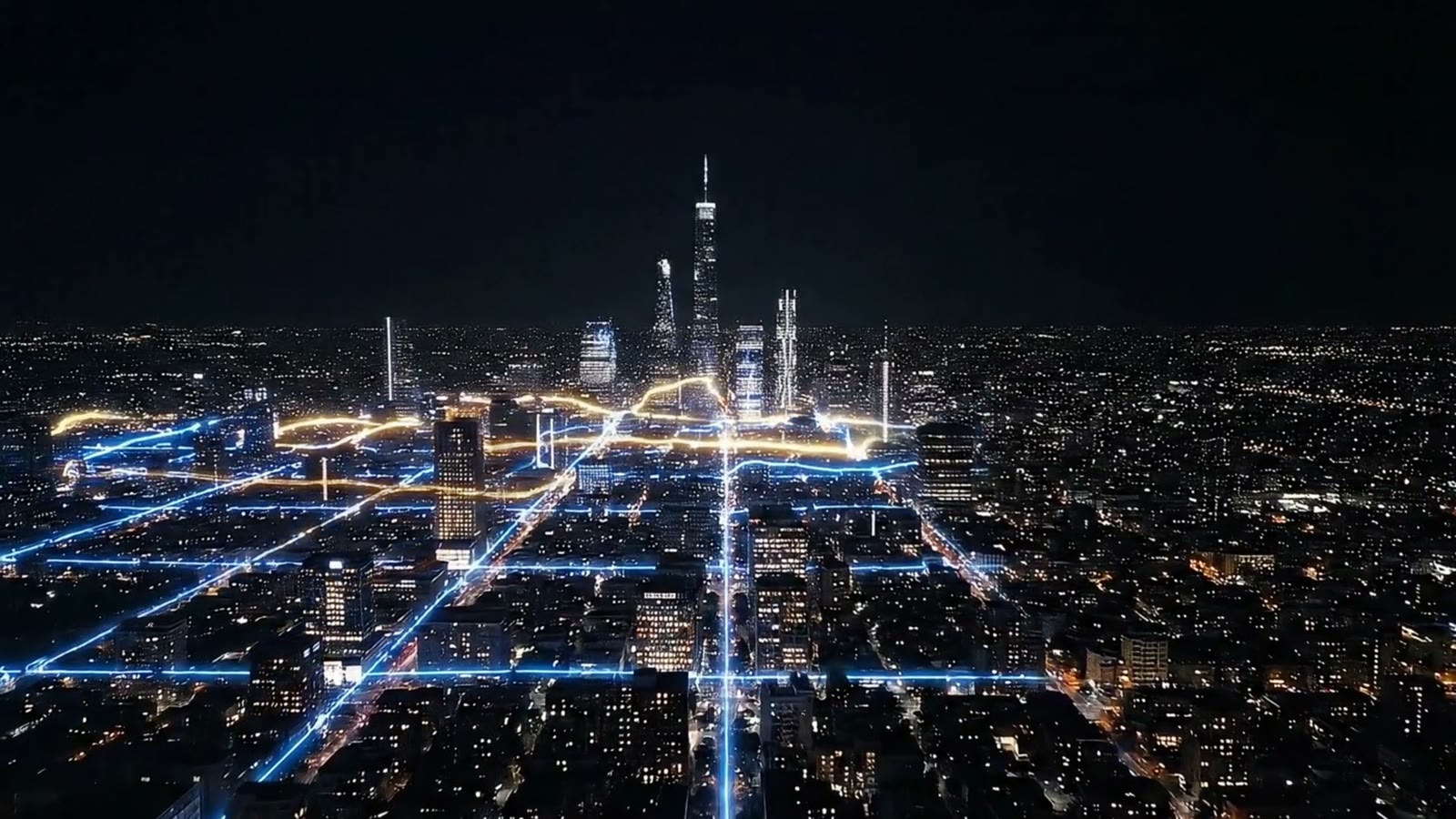 Lines of blue light trace the streets of a city at night