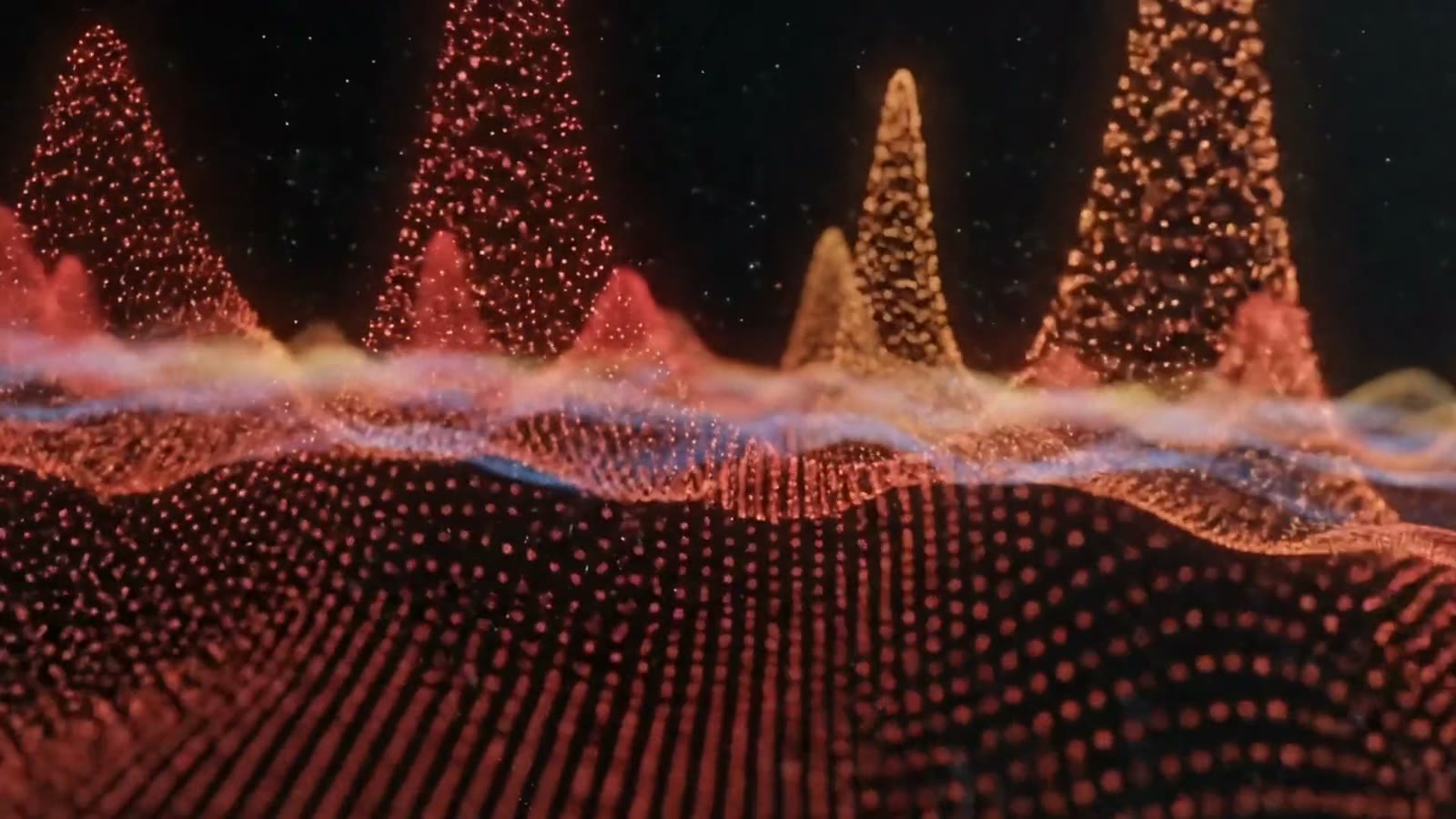 Peaks of red and gold particles rise over a dark plain