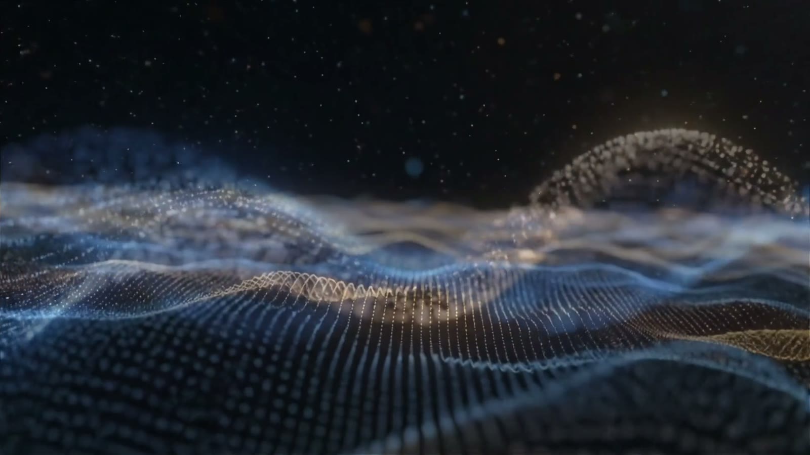 A wave of blue particles rolls across a dark field